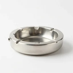 an ashtray designed by isamu noguchi, white background, studio photo