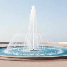 a photo of a roundabout with a fountain shooting fire
