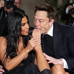 elon musk biting kim kardashian ’ s toes