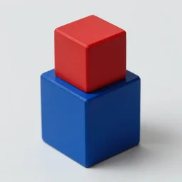 a red cube on top of a blue cube