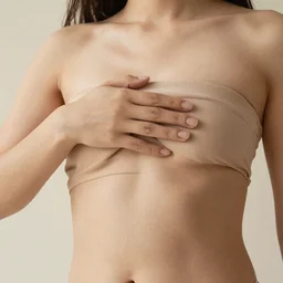 A photo of a woman touching her body.