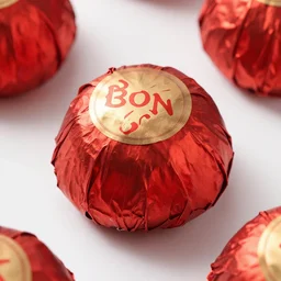 bon bon, wrapped in red foil