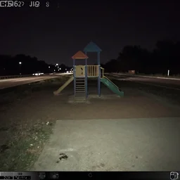 Empty playground in the middle of an abandoned highway at night, broken camera, compressed jpeg, damaged webcam image, grainy damaged photo, trail cam footage