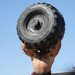 ultra strong man lifting a tank, 1 0 0 mm, award winning, daylight, 8 k, uhd, blue sky, no grass