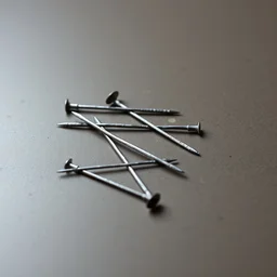 photo of a few nails placed on a table.