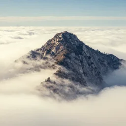 a mountain tip in the clouds. haboku artwork.