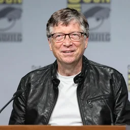 Bill Gates wearing a leather jacket at a press conference