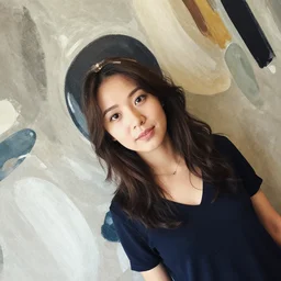a long shot angle of a woman portrait on an abstract painted wall.