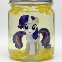 a my little pony figure in a jar covered in a mysterious sticky yellowish fluid