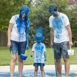 a family being drenched with blue paint