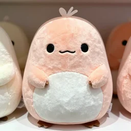 a product display photograph of a coraline squishmallow, 3 5 mm