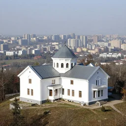 1 9 8 0's white mansion on a mountain, overlooking postsoviet city in the background