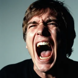 famous close - up portrait of john mcmilly screaming in terror, by photographer annie leibovitz. 8 5 mm lens f / 1. 8, chiaroscuro