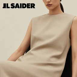 close up of face of female fashion model in minimalistic dress, sitting on chair, beige colors, official jil sander editorial