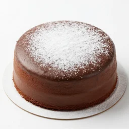 chocolate cake with powdered sugar [ sprinkled ] in the [ shape ] of a [ cat ] on it