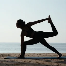silhoutte of woman doing yoga on the beach, photo