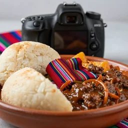 close - up focused dslr photograph of an ecuadorian llapingacho dinner, 8 k, high detail, volumetric lighting, hyperrealism, aesthetically pleasing, studio lighting, trending
