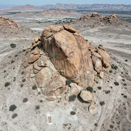 aerial photography, sharp  boulders, cool pale desert, ancient civilization