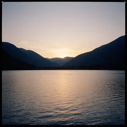 sunset over the lake in the mountains, kodak portra 8 0 0