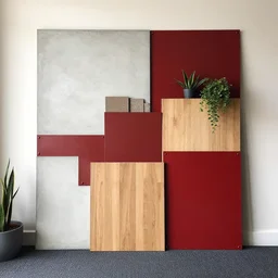 material sample board combining concrete, red painted metal, oak, plants, dark grey carpet, architectural finishes, pinterest, trendy, expressive, warm, eye catching, interior design