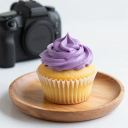 dslr food photography of a lemon cupcake on a wooden plate with purple lemon creme topping and a bottle of lemon sauce on the side, macro shot, hasselblad, 1 0 0 mm f 1. 8, dynamic lightning