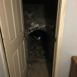 Found out the house we are living in has a bunker below. I managed to squeeze my phone in one of the cracks of the door to take this creepy picture.