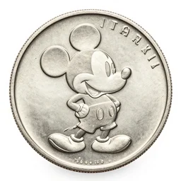 a silver coin with mickey mouse on it