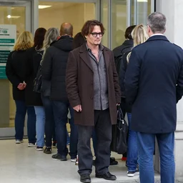 johnny depp waiting in line at the bank