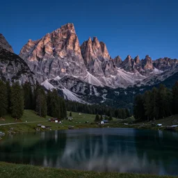 extremely beautiful alpine scenery at night with milkaway, dolomites, calm lake in foreground, by peter lik
