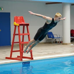 a blond lifeguard in a wetsuit jumping into the pool. Kuvshinov ilya. Repin. Phil Hale