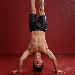 A wet young man is standing on the floor on his head in the red room rain