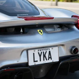 a closeup photorealistic photograph of a racing enzo ferrari license plate lyka. daytime, bright scene, silicon valley. fine detail. this 4 k hd image is trending on artstation, featured on behance, well - rendered, extra crisp, features intricate detail, epic composition and the style of unreal engine.