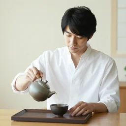 handsome japanese man making tea
