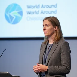 architectural curator beatrice galilee at the world around conference, 8 k photorealistic