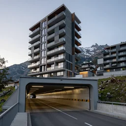 modern condo building and gotthard tunnel entrance combined, wide establishing shot, soft dramatic lighting, sharp focus, 4 k digital camera