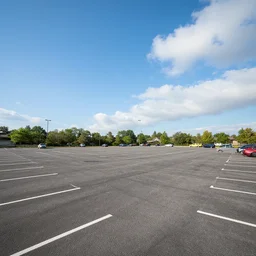 Beatiful Fuzzy Photograph of an infinite  parking lot, Long shot, full shot, wide shot, low angle,wide angle lens