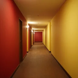 An empty hotel hallway, the walls are red and yellow, liminal space