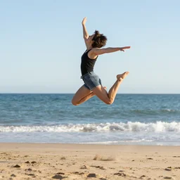 A short hair girl jumping, on Cap d'Agde beach, award winning