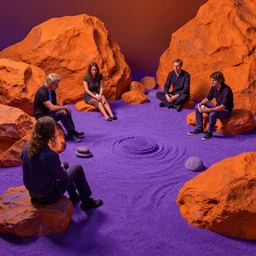 a solarpunk zen garden by simon stalenhag and hubert robert and samuel beal and zacharias aagaard and gillis rombouts, hyperrealism, purple sand, orange rocks, chiaroscuro!!, tonalism!, high saturation, high contrast, vibrant, highly detailed, volumetric light
