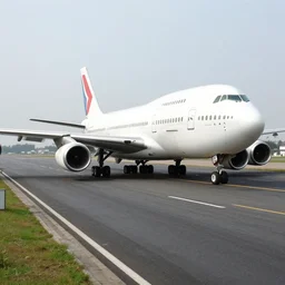 a photo of a commercial jumbo airplane parked in a one way street