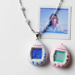 old computer candy necklace, and tamagochi, anaglyph filter, computer graphics by david lachapelle, unsplash, video art