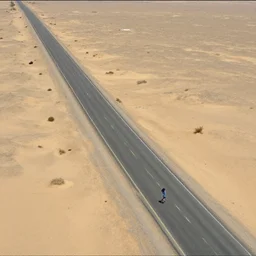 satellite view of a man running on an abandoned road in a desert