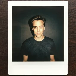 polaroid of dan levy from schitt's creek, harsh flash