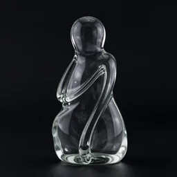 a glass statue made of curves. black background