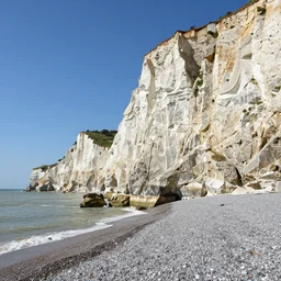 a classic beach scene rock cliffs on a clear day, in neoclassicism style