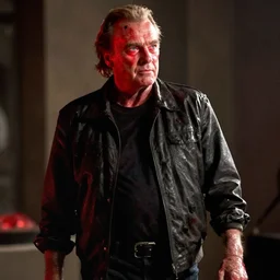 Jack Nicholson plays Terminator, his one yes glow red, he is injured, still from the film