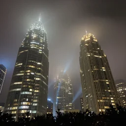 atlanta georgia skyscrapers, low angle, night, fog, lights shining beams into fog,
