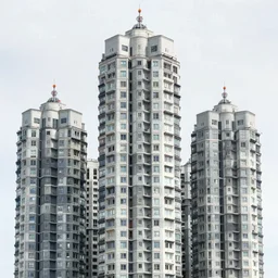 multiple towers made up of squatter housing, sony a 7 r 3, f 2 2, fully frontal view, photographed by wolfgang tillmans, ultra detailed,