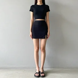 fully body shot of a woman wearing a black crop top and a skirt