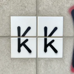 a photograph of a tiled graffiti on cement texture, 4 k, 5 0 mm